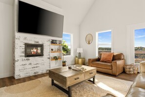 Smart TV, fireplace, table football, books