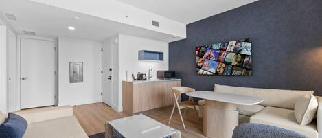 Luxury Room, City View | Living area | 50-inch Smart TV with cable channels