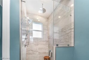 Shower, hair dryer, towels, toilet paper