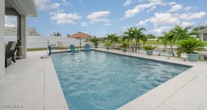 Paradise of Cape Coral on Canal, with Heated Pool, Tiki Hut Grill & Elec Bikes