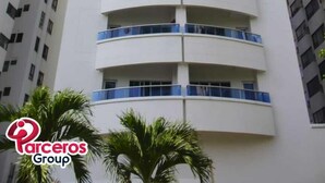 A tall, modern building with multiple balconies and a clear sky. - MIRADOR DEL LAGUITO 404 (Cartagena)