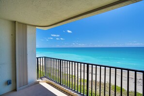 A balcony with a view of the ocean and beach. - Beautiful ocean front, furnished 2-bedroom condo in Jensen Beach (Jensen Beach)