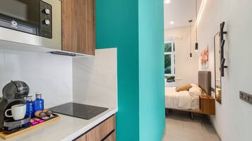 Fridge, microwave, stovetop, coffee/tea maker