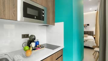 Fridge, microwave, stovetop, coffee/tea maker