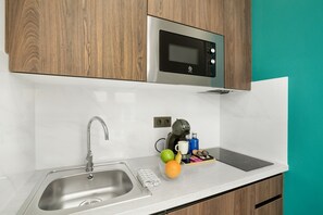 Fridge, microwave, stovetop, coffee/tea maker