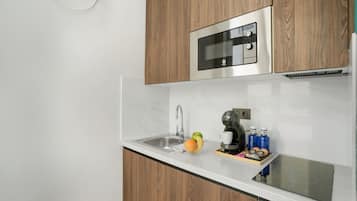 Fridge, microwave, stovetop, coffee/tea maker