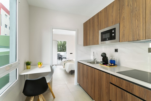 Fridge, microwave, stovetop, coffee/tea maker