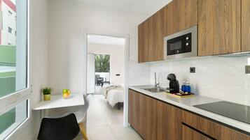 Fridge, microwave, stovetop, coffee/tea maker