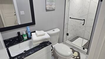 Shower, hair dryer, towels, soap