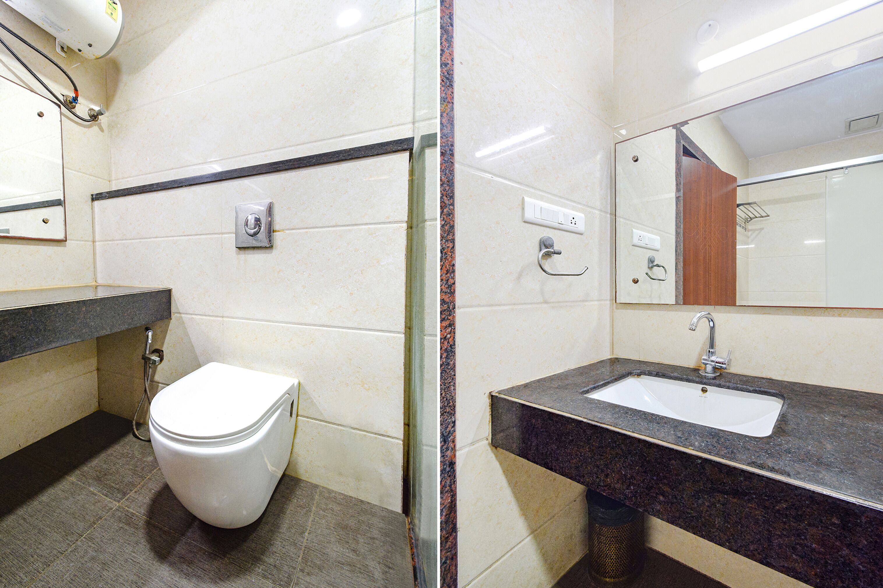 A modern bathroom with a white toilet, a sink, and a mirror.