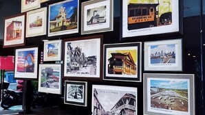 A wall of framed photographs depicting various buildings and landmarks. - Chariton Hotel Skudai Kiri (Johor Bahru)