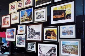 A wall of framed photographs depicting various buildings and landmarks. - Chariton Hotel Skudai Kiri (Johor Bahru)
