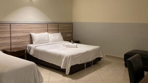 A hotel room with a bed, bedside tables, and a chair. - Chariton Hotel Skudai Kiri (Johor Bahru)