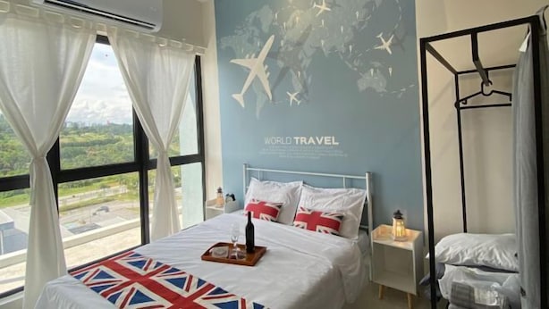 A hotel room with a large bed, a map on the wall, and a view of the countryside. - Terminal VIP Lounge @ Near KLIA Sepang (Sepang)