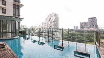 A rooftop infinity pool with clear views of the cityscape.