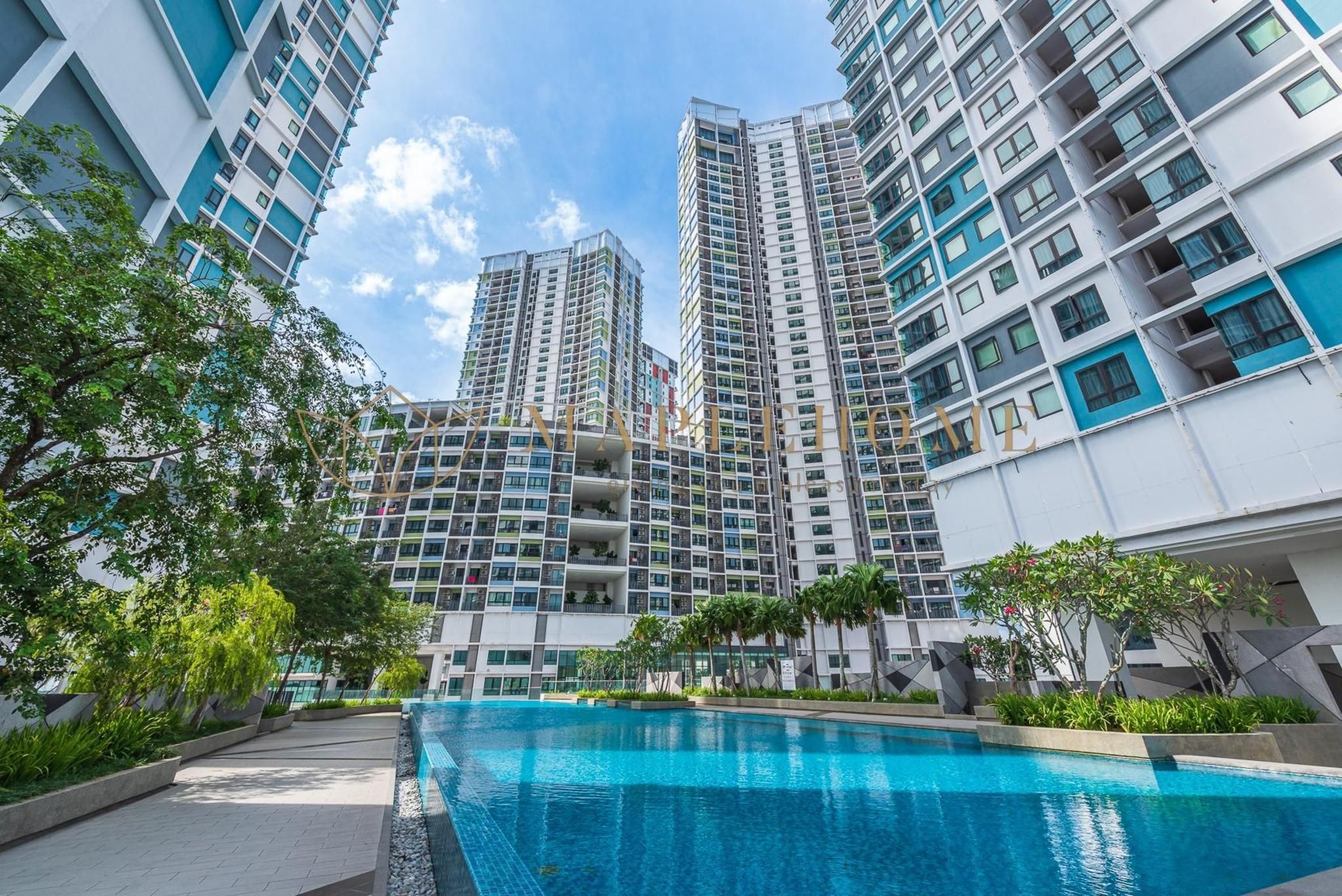 A modern high-rise residential building with a swimming pool in the foreground.