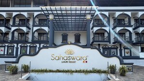 A luxury resort with a prominent entrance, multiple balconies, and a decorative sign. - Sahaswara Luxury Resort (Anjuna)