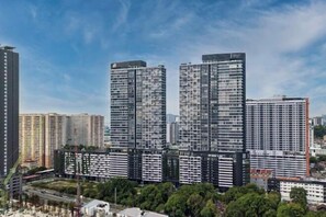 A high-rise building with multiple floors, large windows, and a modern architectural design. - Urban Suites by Stellar ALV (Jelutong)
