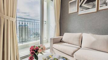 Family Apartment | Living area | 90-inch LED TV with digital channels