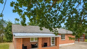 A single-story brick house with a covered patio area. - "Agla" - 2.5km from the sea by Interhome (Nørre Nebel)