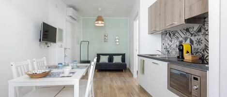 Fridge, microwave, stovetop, coffee/tea maker