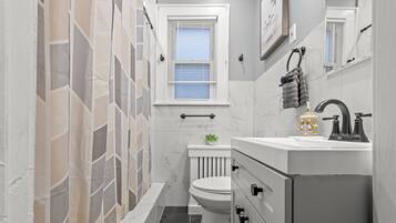 Eco-friendly toiletries, hair dryer, towels, toilet paper