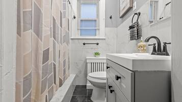 Eco-friendly toiletries, hair dryer, towels, toilet paper