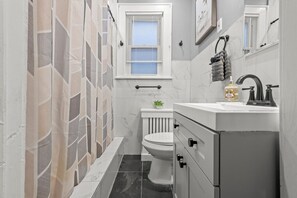 Eco-friendly toiletries, hair dryer, towels, toilet paper