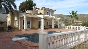 A house with a swimming pool, patio, and a white fence. - beautiful villa with sea and mountain views. (El Campello)