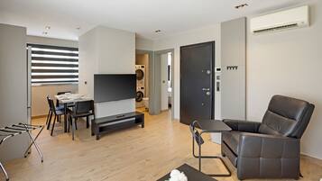 Deluxe Apartment, Non Smoking, Kitchen | Living area | 55-inch Smart TV with satellite channels