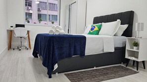 1 bedroom, desk, iron/ironing board, travel crib