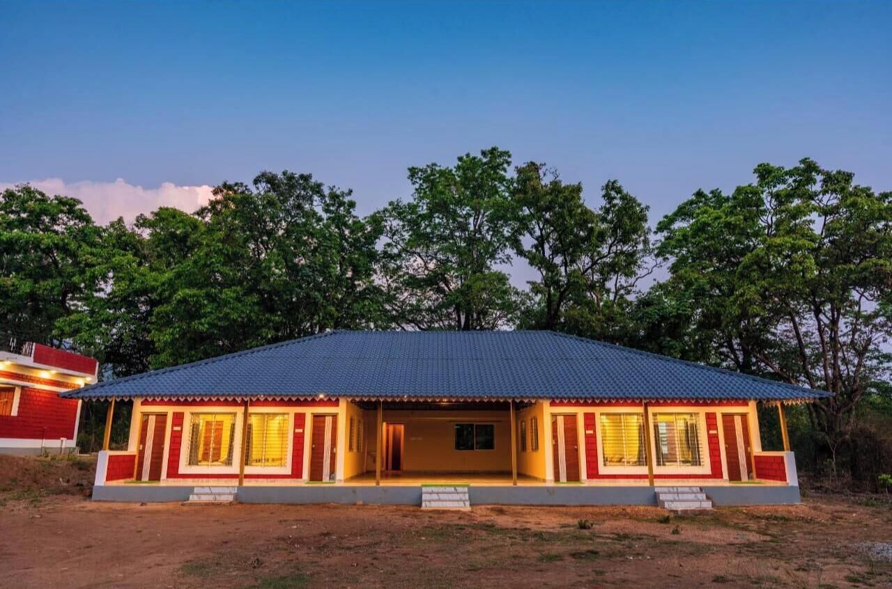 A single-story building with a flat roof and a porch.