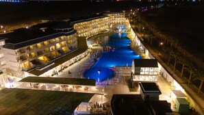 A hotel with multiple swimming pools, a covered area, and a dining terrace. - Flow Spectrum Resort Sahl Hasheesh (Sahl Hasheeh)