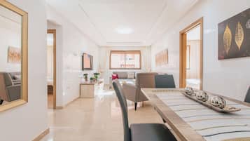 Deluxe Apartment | Living area | 52-inch LCD TV with satellite channels, TV, Netflix