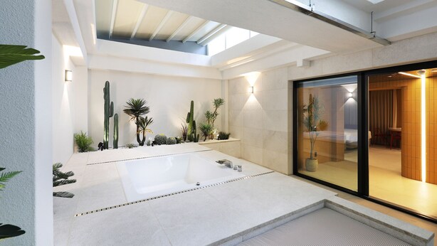 A modern bathroom with a large bathtub, skylight, and a glass shower enclosure. - Seoul Inn Hotel by the Designers (Seoul)