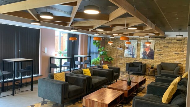 A modern lounge area with sofas, tables, and pendant lighting. - For Students Only Canvas The Heights in Birmingham (Birmingham)