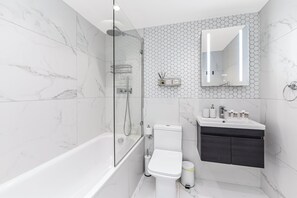 Shower, hair dryer, towels, soap