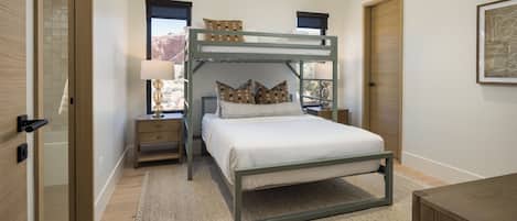 Premium bedding, pillow-top beds, laptop workspace, iron/ironing board