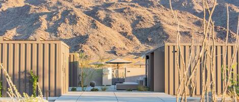 A modern building with a flat roof and a large entrance.