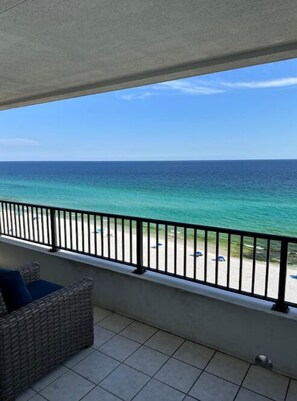 A balcony with a view of the ocean and beach. - Beachfront Oasis! 2BR,2BA with Private Beach Access and free upfront parking. (Destin)
