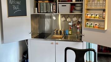 Fridge, microwave, stovetop, coffee/tea maker