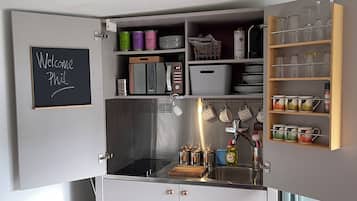 Fridge, microwave, stovetop, coffee/tea maker