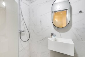 Shower, hair dryer, towels, soap