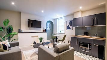 Deluxe Studio Suite, City View | Laptop workspace, iron/ironing board, free WiFi, bed sheets