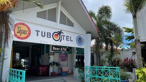 A TUBOTEL with a sign for Tapaz and a Beer ATM. - Tubotel Langkawi (Langkawi)