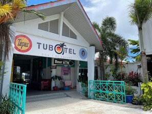 A TUBOTEL with a sign for Tapaz and a Beer ATM.