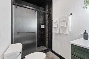 Shower, hair dryer, towels