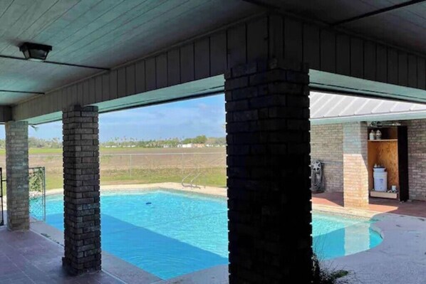 Relax by the pool surrounded by lush views.