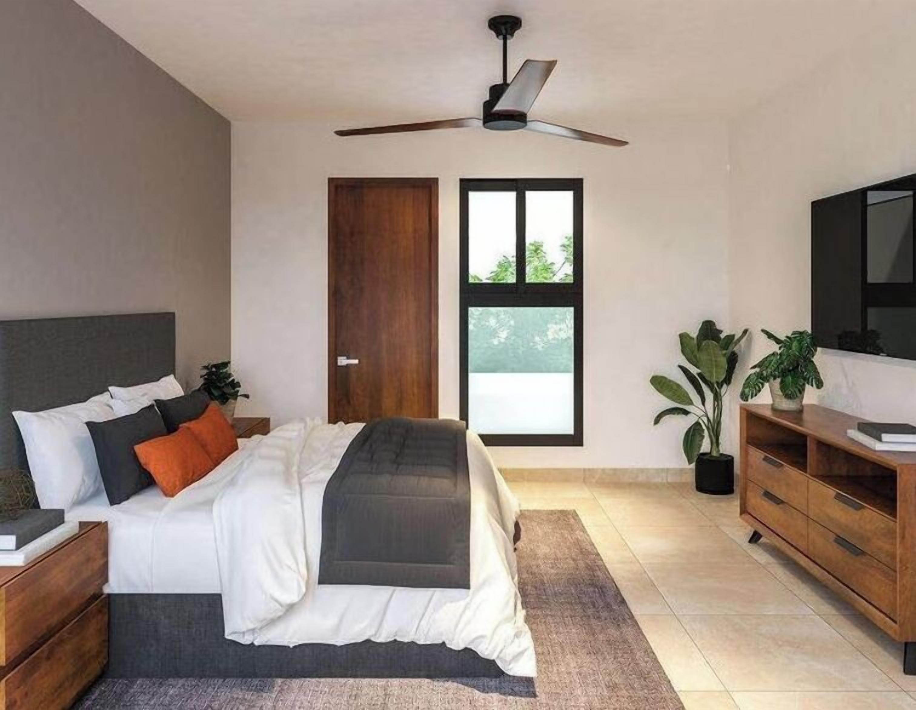 A modern bedroom with a bed, nightstands, a wooden dresser, a ceiling fan, a window, and potted plants.