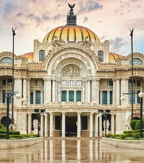 Experience the grandeur of Palacio de Bellas Artes, featuring a stunning dome, ornate sculptures, and classical columns.